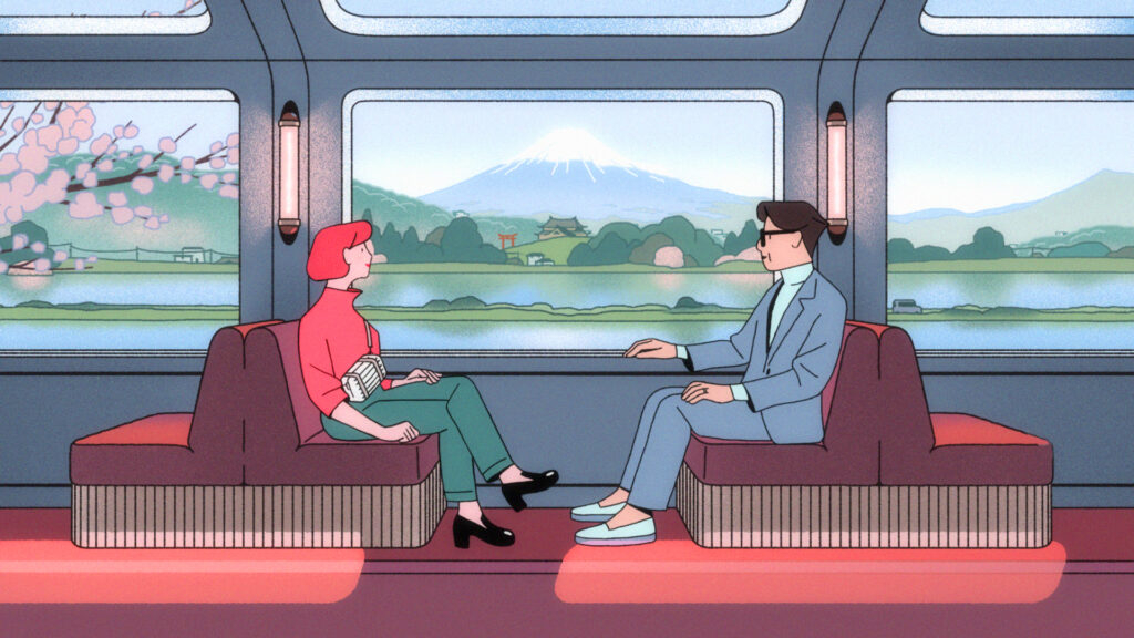 two people sitting on a ledge talking